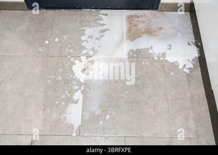 top view of milk stains on grey floor Stock Photo