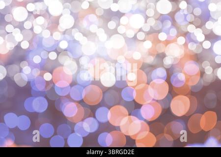 Multicolored bokeh light circles are floating in abstract flat design, white lavender orange hues Stock Photo
