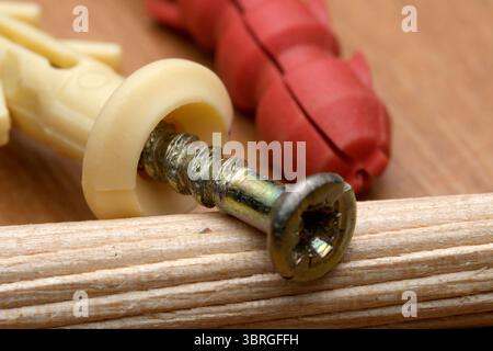 Craft supplies neatly arranged on a wooden workspace, showcasing creativity. Stock Photo