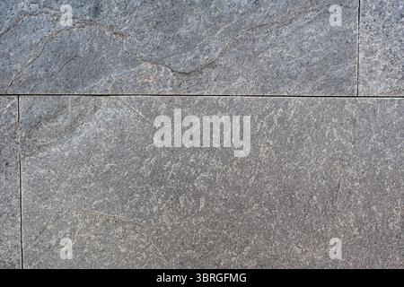 Subtle gray stone surface features intricate patterns and textures. Stock Photo