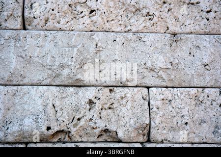 Rustic stone structure features unique textures and earthy tones Stock Photo
