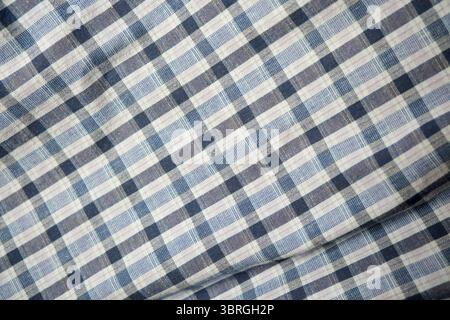 A close-up look at a classic plaid fabric showcasing a blend of colors. Stock Photo