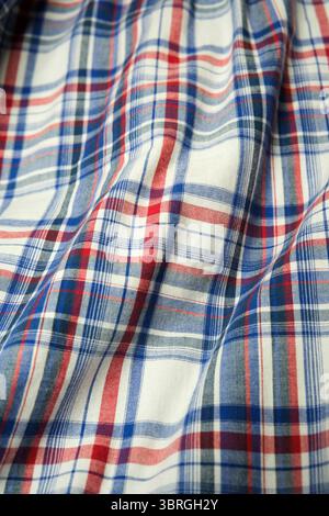 Vibrant plaid material displays intricate patterns and colors beautifully. Stock Photo