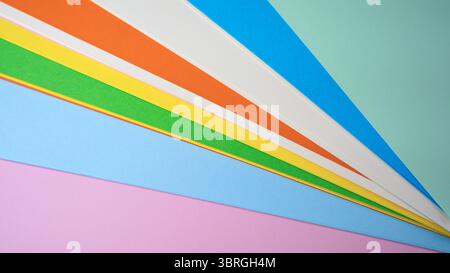 Different shades of paper create a colorful display on a flat surface. Stock Photo
