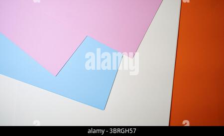 Brightly colored sheets of paper lay on a surface in vibrant hues. Stock Photo