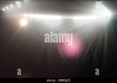 Multiple bright lens flares, starbursts and colored orbs are streaming across dark flat backdrop Stock Photo