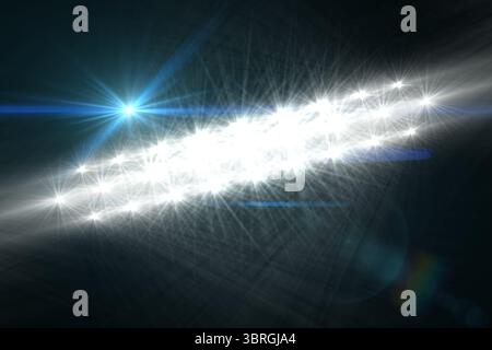 Bright starburst lights are creating diffraction pattern with flares on dark backdrop in vector art Stock Photo