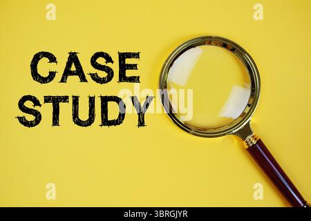 Case Study text with magnifying glass on yellow background Stock Photo