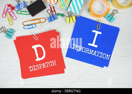 DI - Dispatch information text on stick note with stationery on concrete background Stock Photo