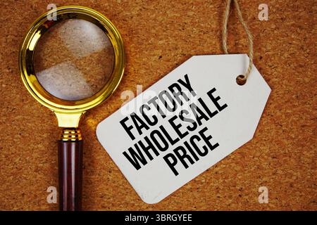 Factory Wholesale Price text on price tag with magnifying glass on cork board background Stock Photo