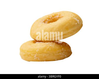 Side view of two brown sugar glazed cinnamon donuts in stack is isolated on white background with clipping path. Stock Photo