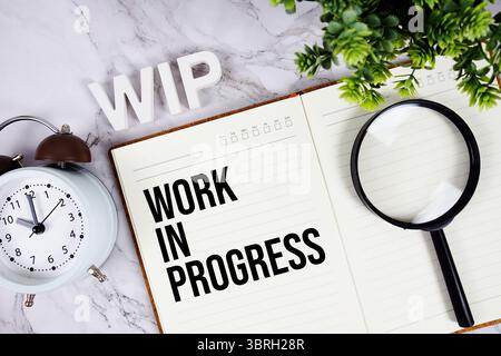 WIP - Work In Progress acronym on notepad, Business concept background Stock Photo
