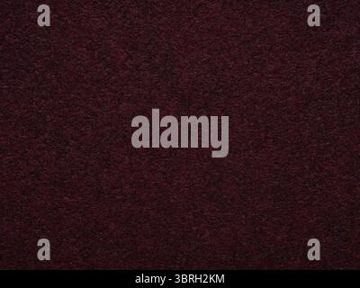 A deep plum enigma, this felt surface captivates with its rich, luxurious texture and a hint of nocturnal mystery Stock Photo