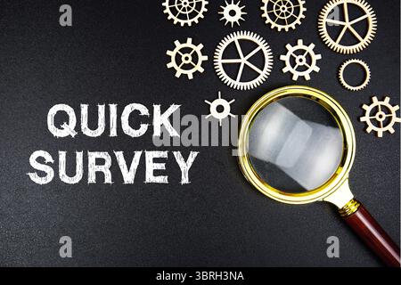 Quick Survey text message with magnifying glass on black background Stock Photo
