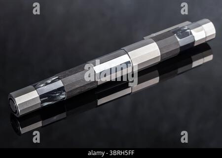 Branded pen with ink and nib in a box. Gift set. Selective focus. Office interior. Stock Photo