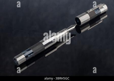 Branded pen with ink and nib in a box. Gift set. Selective focus. Office interior. Stock Photo