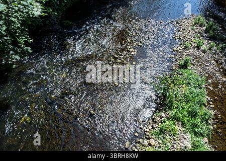 Sparkling water on fast flowing river. Stock Photo