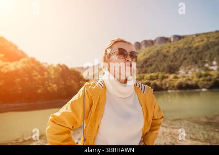 Woman Sunglasses River Posing Outdoors in Sunny Day Stock Photo