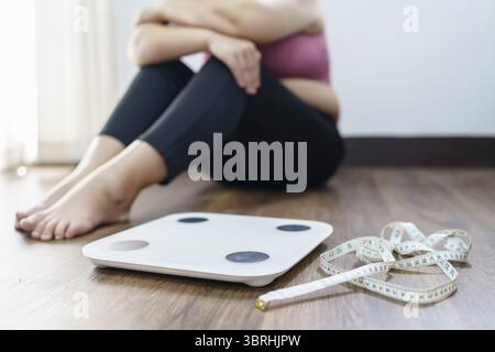 Weight Scale Photo Fail Obese Woman with fat upset bored of dieting Weight loss fail Fat diet ...