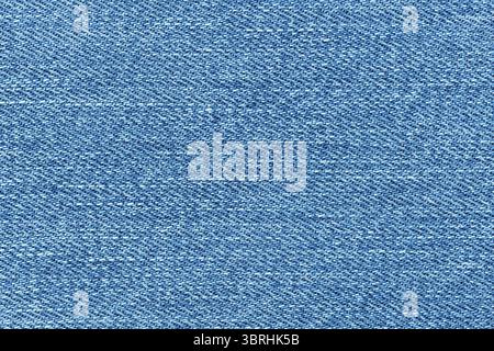 Texture of blue jeans denim background. Canvas blue denim. Top view closeup of grunge blue jeans denim Stock Photo