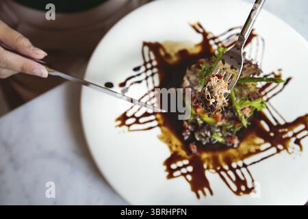 Luxury table settings for fine dining served and decorated table with food for guests in the celebration restaurant Stock Photo