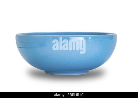 Empty single blue ceramic bowl isolated on white background with clipping path, closeup, side view, horizontal format Stock Photo