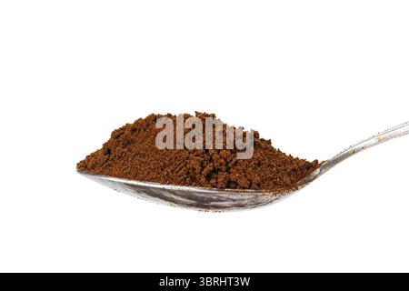Side view of organic instant coffee powder in metal teaspoon isolated on white background with clipping path Stock Photo