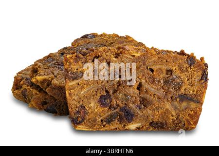 Closeup view of sliced delicious homemade fruitcake isolated on white background with clipping path Stock Photo