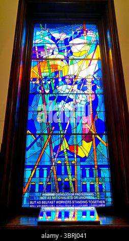In blue tones stained glass window inside Belfast City Hall commemorating the dockers' strike, Northern Ireland Stock Photo