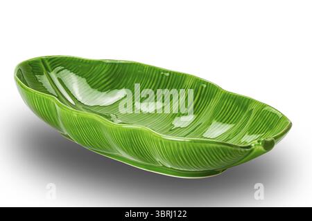 Empty green ceramic bowl isolated on white background with clipping path. Closeup view of beautiful design vibrant green ceramic bowl Stock Photo