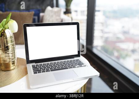 Laptop with Mock up blank screen on table in front of cafe space for text. product display computer laptop montage- technology concept Stock Photo