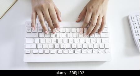 Hands typing on keyboard. writing a blog. woman hands on the keyboard Working at home. hand are in finger typewriter Stock Photo
