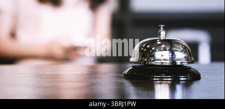Hotel reception counter desk with service bell Stock Photo