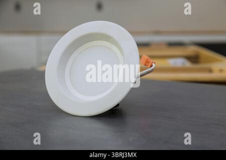 Replacing of LED light in new home the electrician light the installation Stock Photo