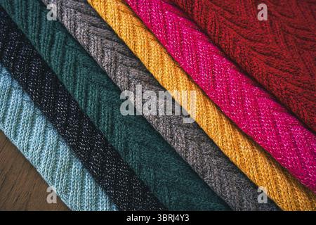 Multi colored Knitted woolen fabric texture background for winter Stock Photo
