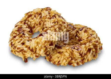 Closeup view of crispy homemade sweet rice crackers with cane sugar syrup isolated on white background with clipping path Stock Photo