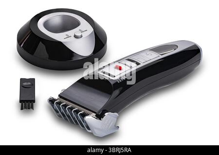 Set of pet hair clipper with charging base and cleaning brush isolated on white background with clipping path Stock Photo