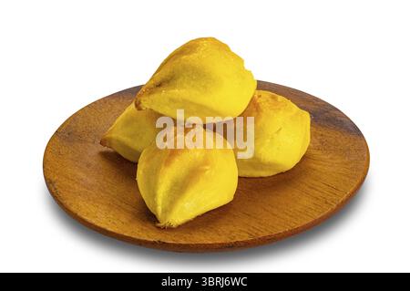 Pile of delicious homemade mini pineapple pie in wooden plate isolated on white background with clipping path Stock Photo