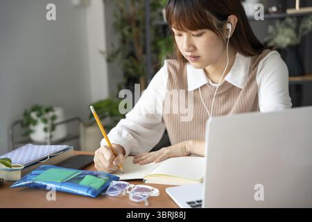Asian woman learning online class by laptop Stock Photo