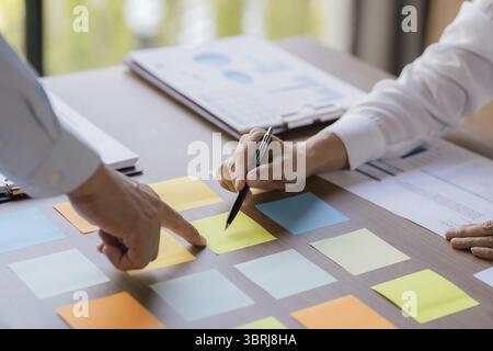 Business People brainstorming Meeting Design Ideas use sticky note notes to share idea professional investor start up project business brainstorming plann Stock Photo