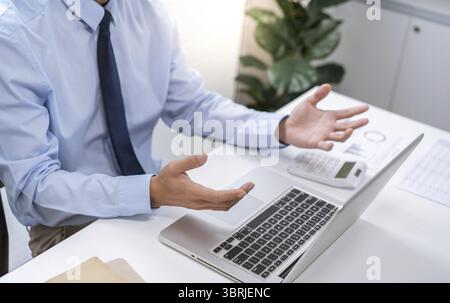 VDO Call Conference Man work from home. talk chat online on video call on laptop webcam conference Asian businessman working online E learning and soc Stock Photo
