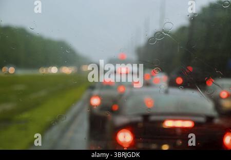 Heavy traffic during a rainy day rain drops on the window Stock Photo