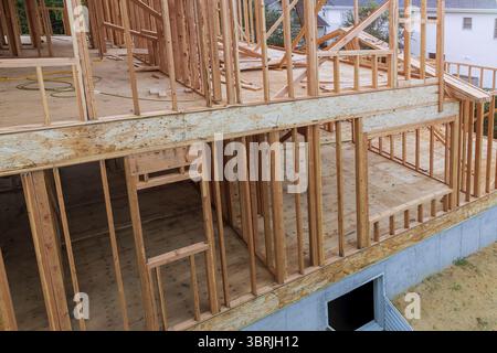 New house under residential construction home exterior framing Stock Photo