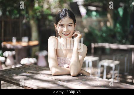 Portrait of Smiling Beautiful asian young woman wellness portrait outdoor happiness Stock Photo