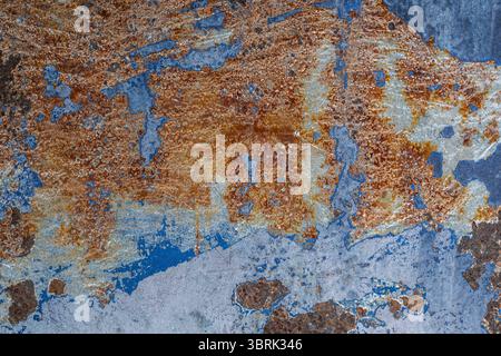 Rusty and Weathered Metallic Surface with Blue and Orange Texture Stock Photo