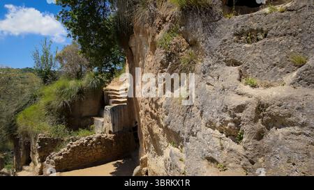 Sandstone steps leading to the ancient rupestrian settlement of Zungri, a village carved into the rock in the province of Vibo Valentia, Calabria, Sou Stock Photo