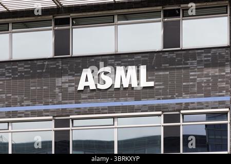 The ASML logo prominently displayed on the facade of their modern ...