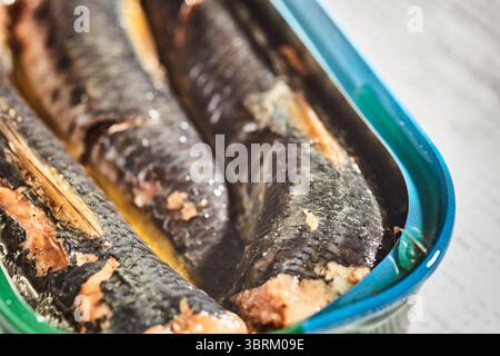 An open can (tin) of Pacific sardines with the skin on. Stock Photo