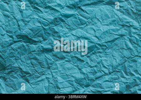Crumpled Turquoise Paper Texture Background Close-Up Stock Photo