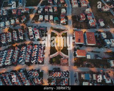 Aerial view of the illuminated streets and residential rooftops of ...